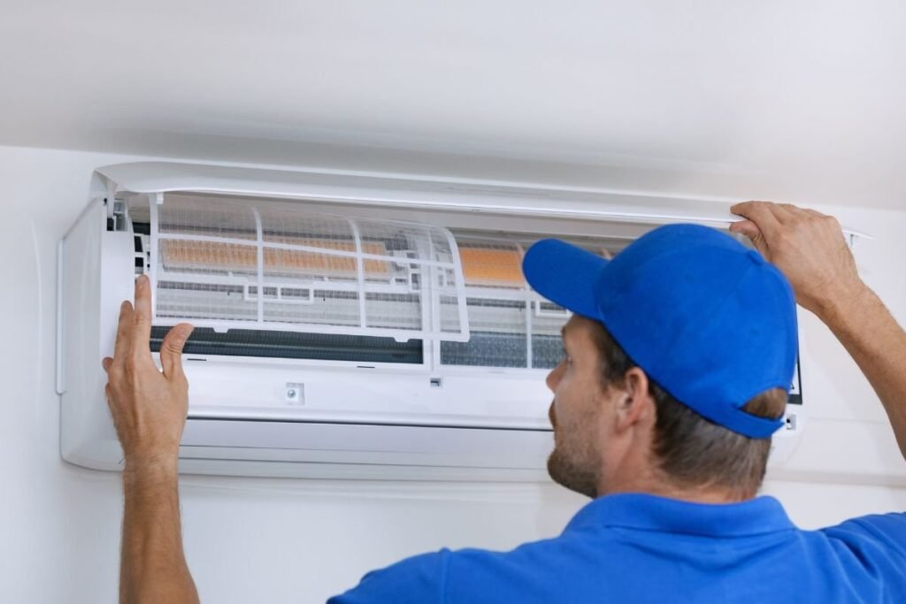 A skilled man demos the parts of an ac unit.