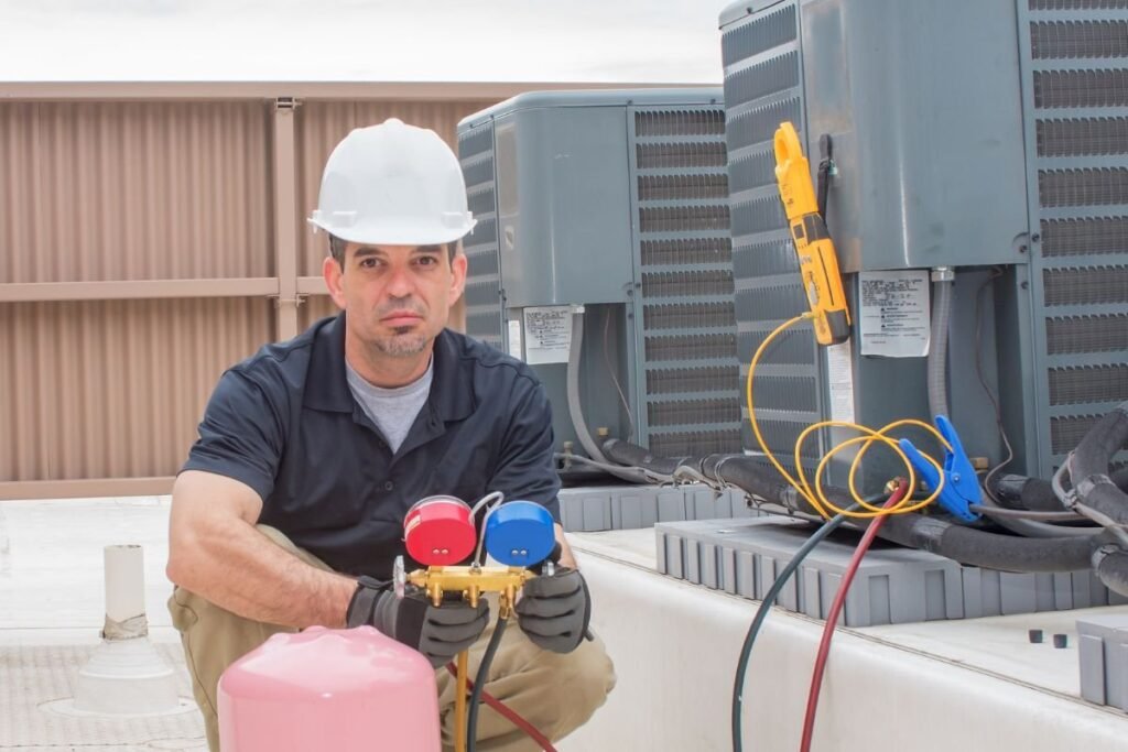An HVAC contractor working on a new air conditioner installation.