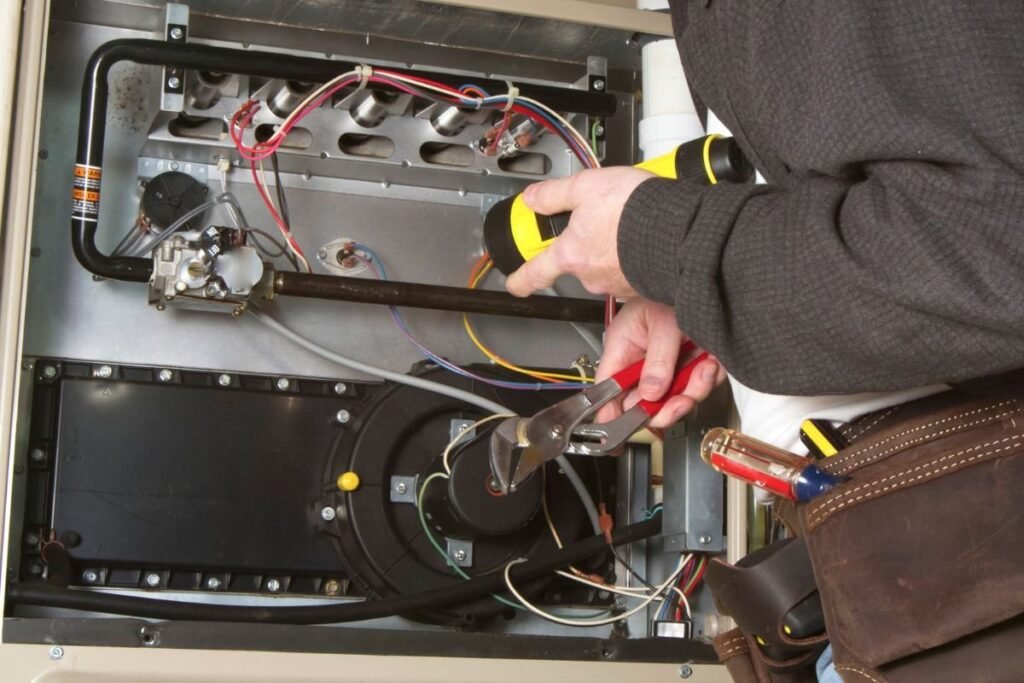 An expert checks the furnace fan that is not working.