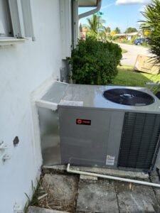 HVAC replacement heat pump installed in front of a single-family home, showcasing its modern design and outdoor functionality
