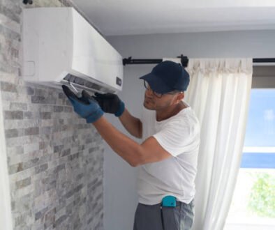 AC not turning on – technician repairing an air conditioner indoors with tools and equipment visible.