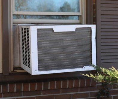 Exterior view of a sliding window air conditioner unit designed for horizontal window installation.