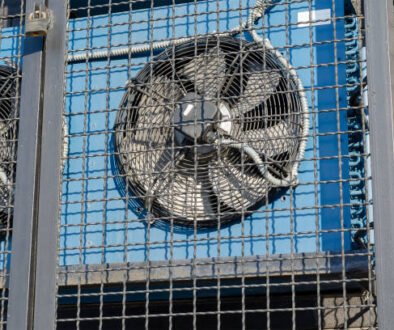 Two air conditioners mounted on a metal cage, with the sound of AC compressors humming in the background.