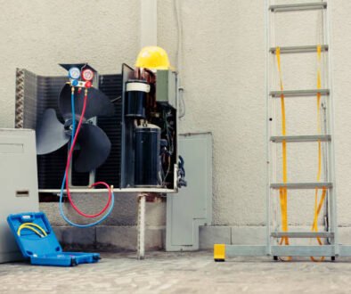 A man works on an air conditioner in a room, troubleshooting a broken fanA man works on an air conditioner in a room, troubleshooting a broken fan in AC unit