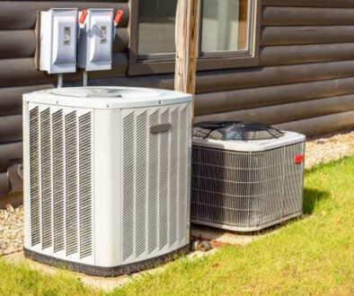A heat pump and air conditioner installed outside a cabin, highlighting energy-efficient cooling solutions.