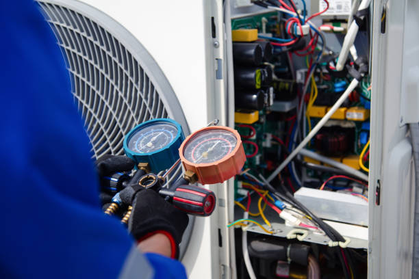 A prominent air conditioning unit installed outside a house, showcasing licensed HVAC expertise.