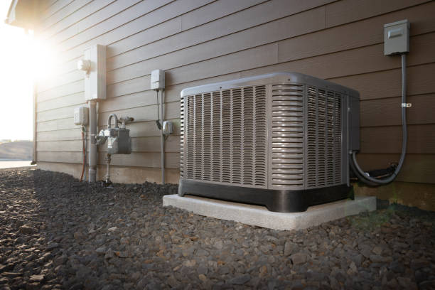 A sizable air conditioner located in front of a residence, reflecting the work of a licensed HVAC professional.