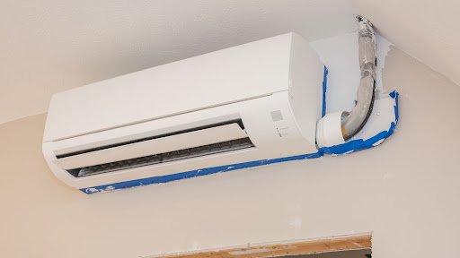 Ten Reasons Why Ductless AC Installation in Margate, Florida is Worth Every Penny 1 A white ductless air conditioner mounted on the wall, showcasing a clean and modern ductless AC installation.