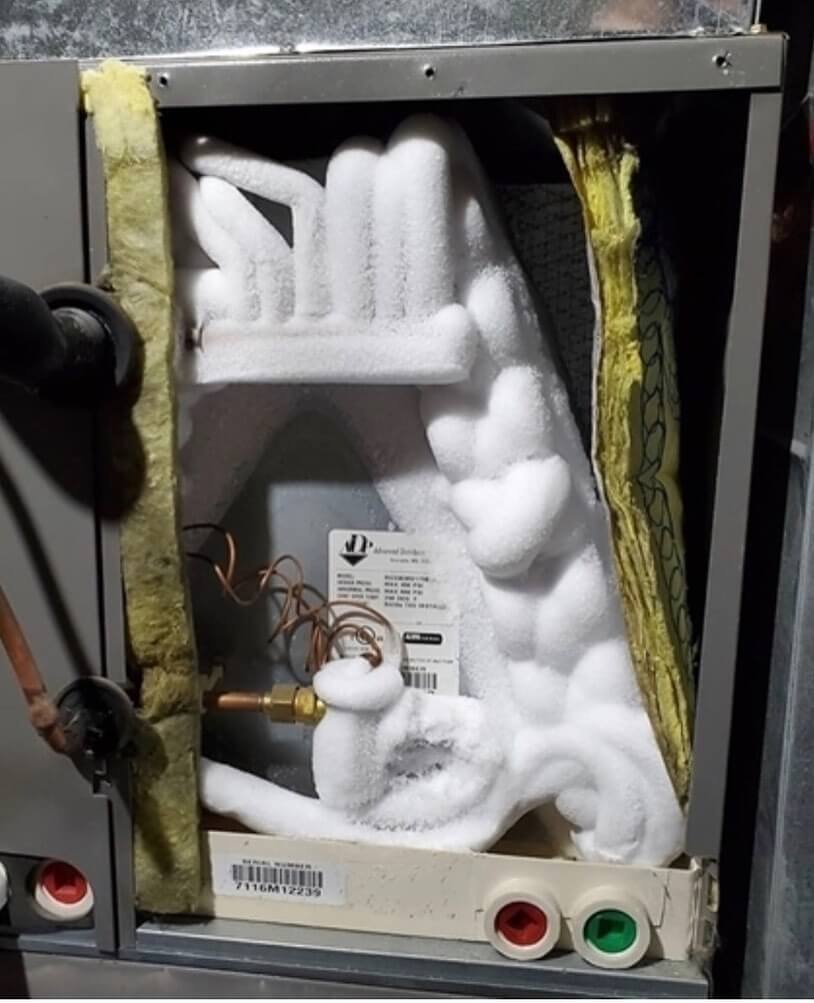 ice forming on AC unit indicating frozen AC unit repair needed for system fix