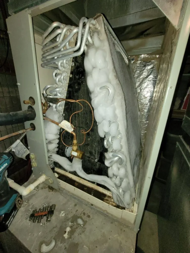 low refrigerant levels diagnosis during frozen AC unit repair HVAC service